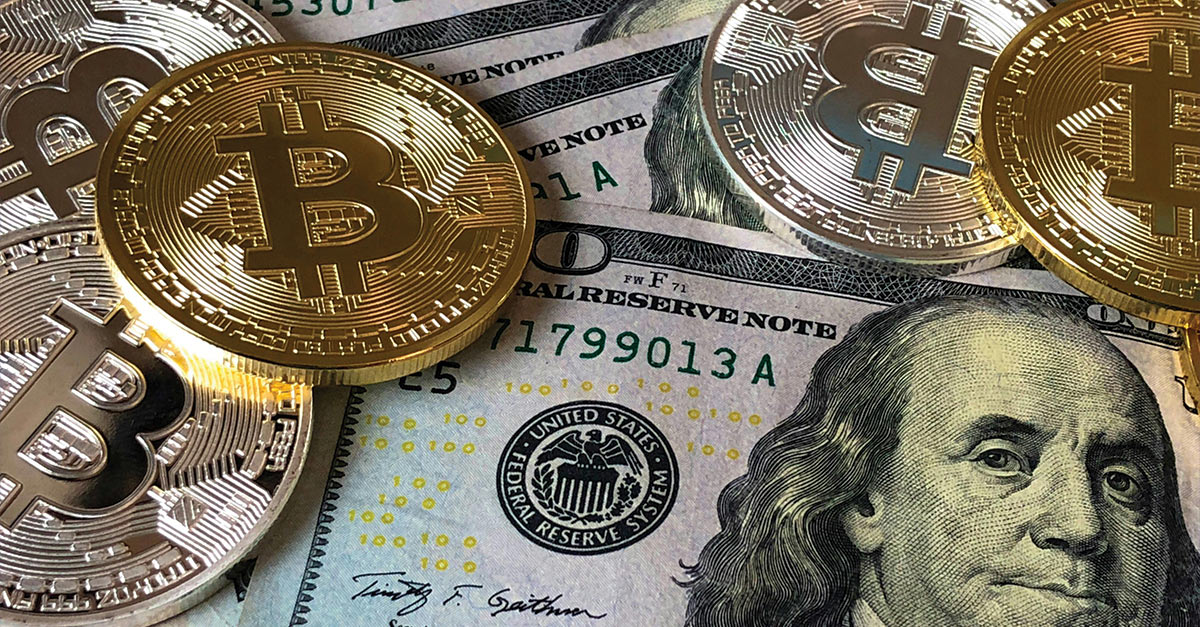 bitcoins and a US hundred dollar bill illustrate finances at risk from fraud