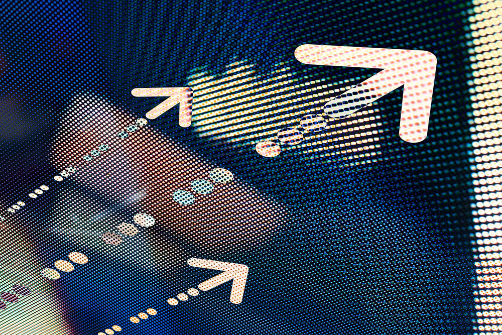 Evertas Announces Significant Crypto Insurance Capacity Expansion Grainy looking picture of dots that are blue and yellow with yellowish arrows pointing to the top right